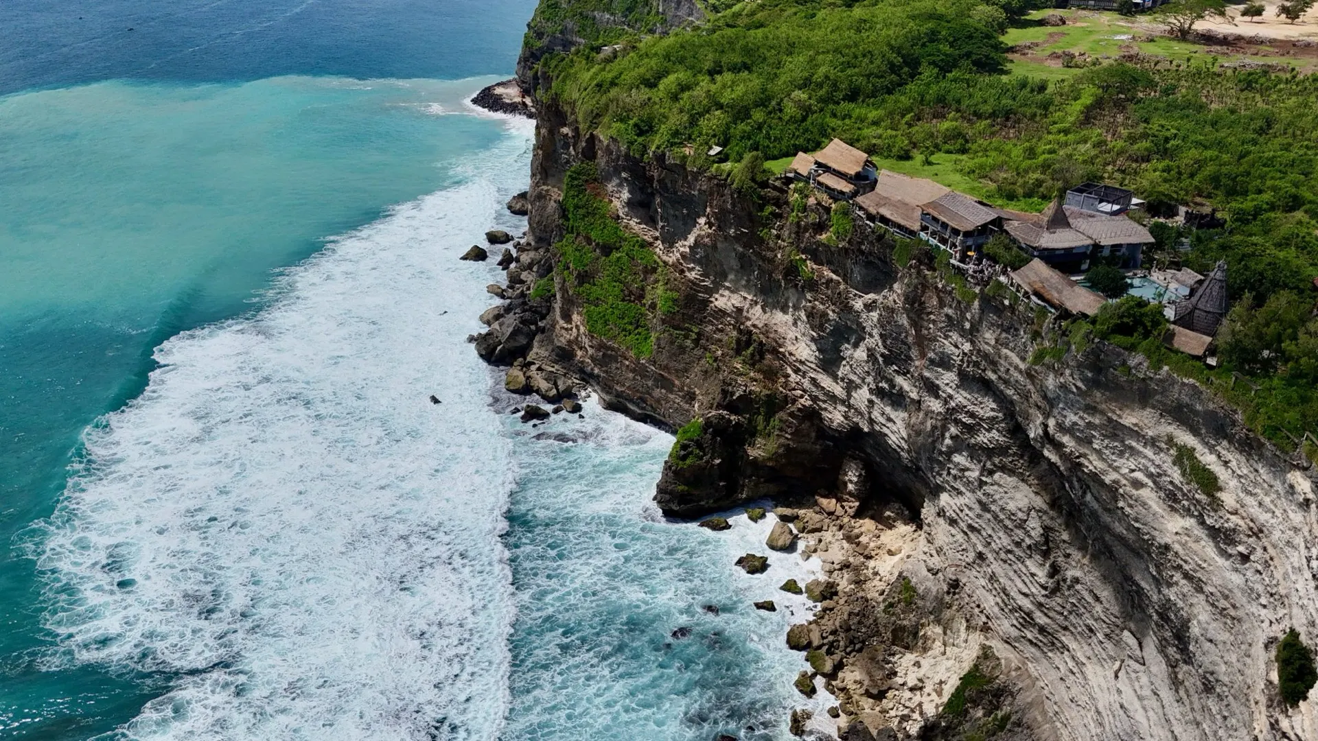 A cliffside restaurant perched above the surf south of Uluwatu