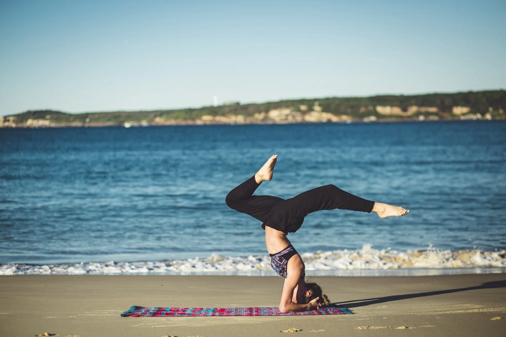 A yoga practice on the beach by the ocean